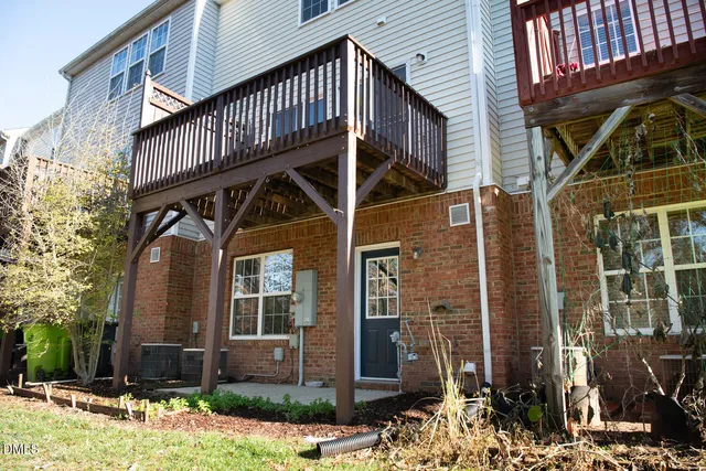 an aerial view of a residential houses with outdoor space