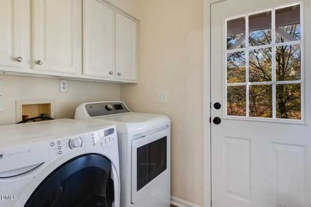wooden floor fireplace and windows in an empty room