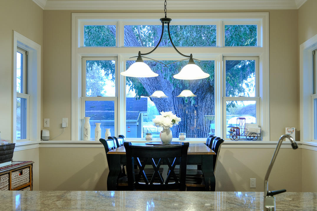 375 Hamilton Road Jacksonville, OR 97530 - Photo 6 of 47 a view of a dining room with furniture and chandelier