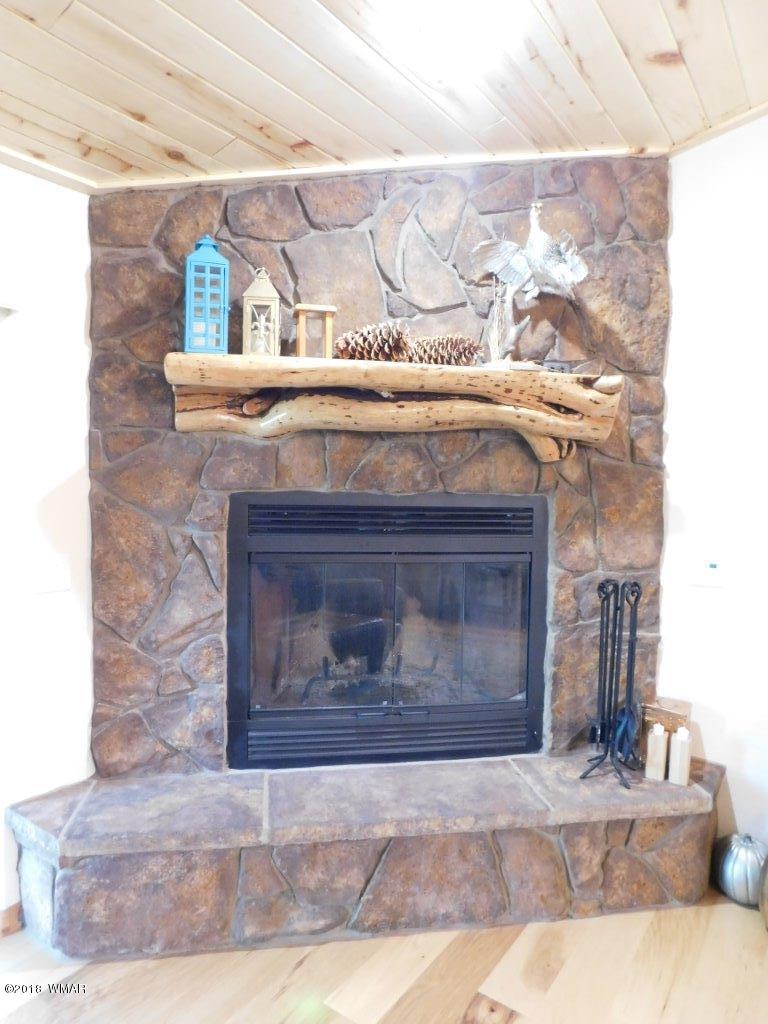 1941 Rim View Lane Heber, AZ 85928 - Photo 11 of 41 a view of fireplace and wooden floor