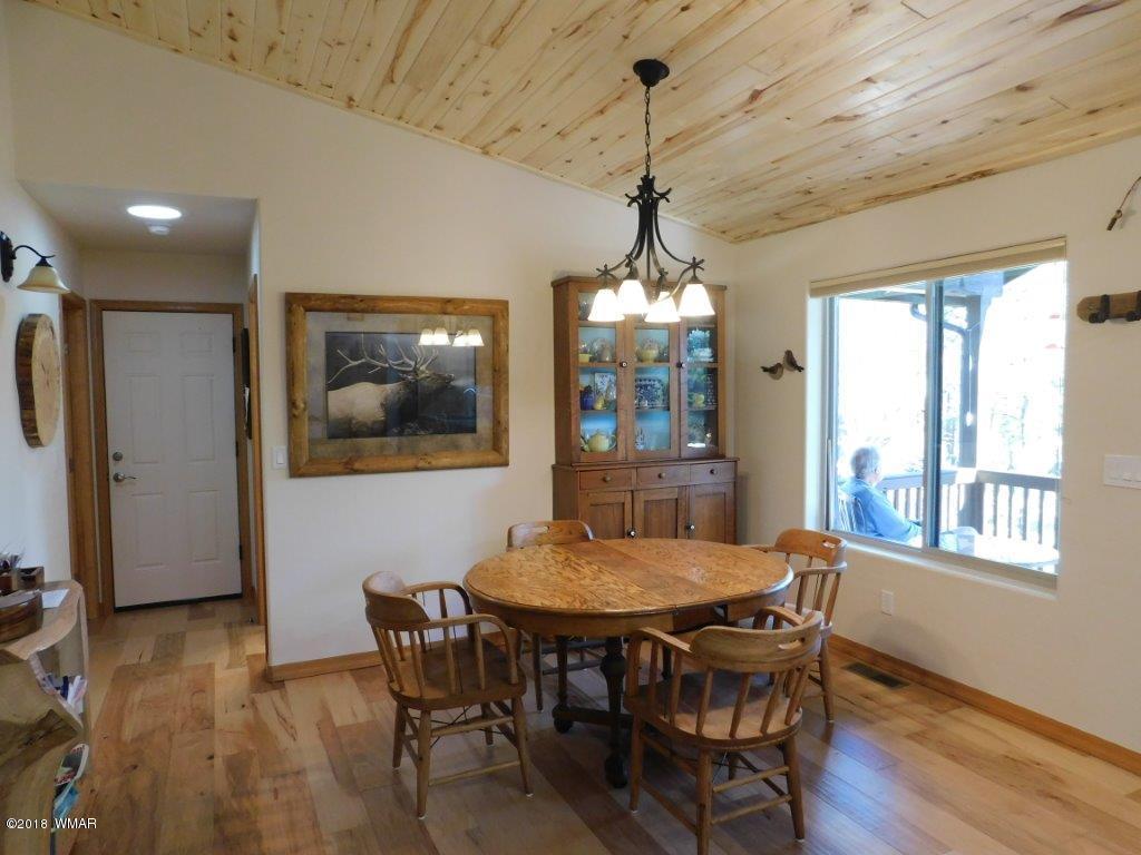 1941 Rim View Lane Heber, AZ 85928 - Photo 17 of 41 a view of a dining room with furniture window and wooden floor