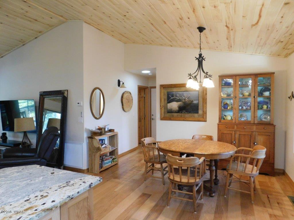 1941 Rim View Lane Heber, AZ 85928 - Photo 18 of 41 a view of a dining room with furniture window and wooden floor