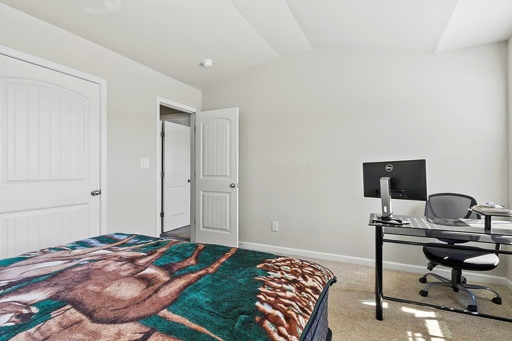 184 Amelia Drive Byron, GA 31008 - Photo 23 of 43 a bedroom with a bed and a computer on a desk