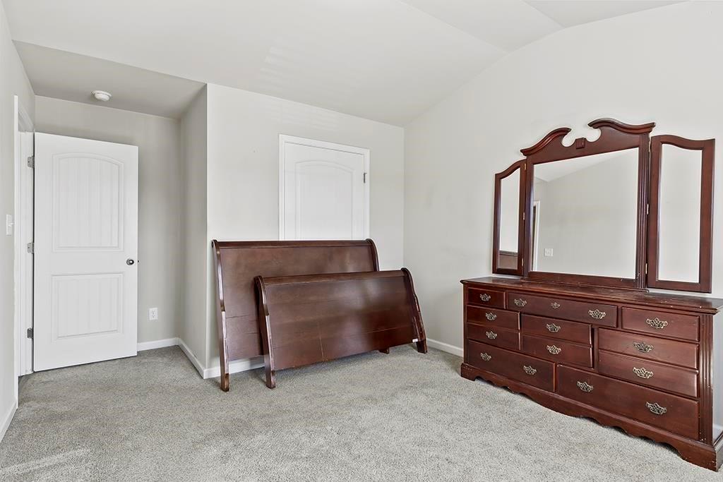 184 Amelia Drive Byron, GA 31008 - Photo 24 of 43 a room with a dresser and a mirror