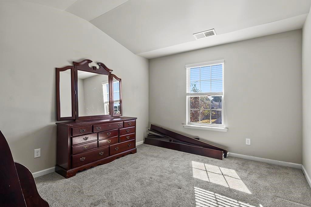 184 Amelia Drive Byron, GA 31008 - Photo 25 of 43 a room with a dresser and a mirror