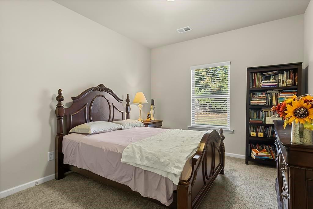 184 Amelia Drive Byron, GA 31008 - Photo 28 of 43 a bedroom with a bed and a window