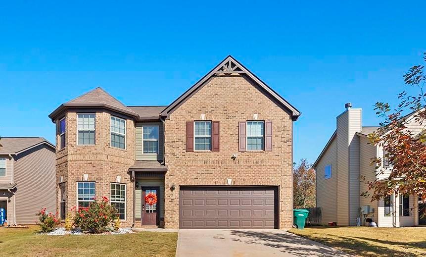 184 Amelia Drive Byron, GA 31008 - Photo 33 of 43 a front view of a house with a yard