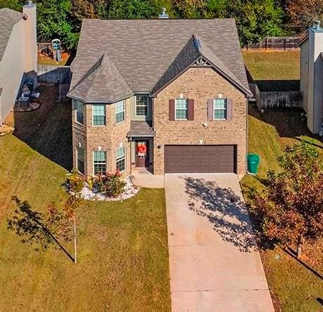 184 Amelia Drive Byron, GA 31008 - Photo 42 of 43 a front view of a house with garden