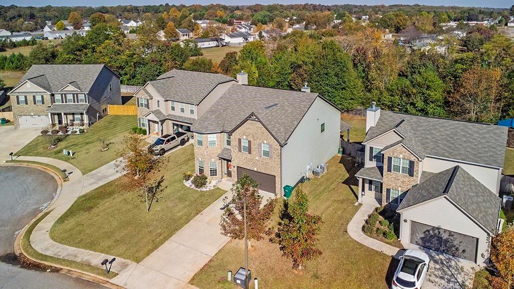 184 Amelia Drive Byron, GA 31008 - Photo 43 of 43 an aerial view of a house with a swimming pool and mountains