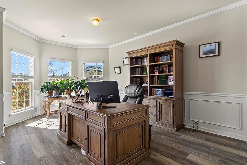 184 Amelia Drive Byron, GA 31008 - Photo 7 of 43 a view of a workspace with furniture and a potted plant