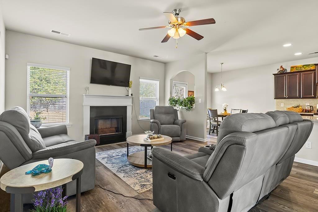184 Amelia Drive Byron, GA 31008 - Photo 8 of 43 a living room with furniture a fireplace and a flat screen tv