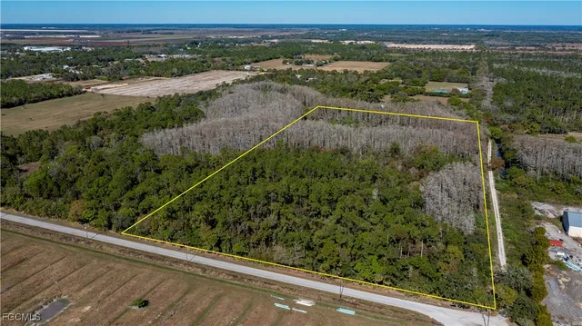 an aerial view of a yard with a lake view