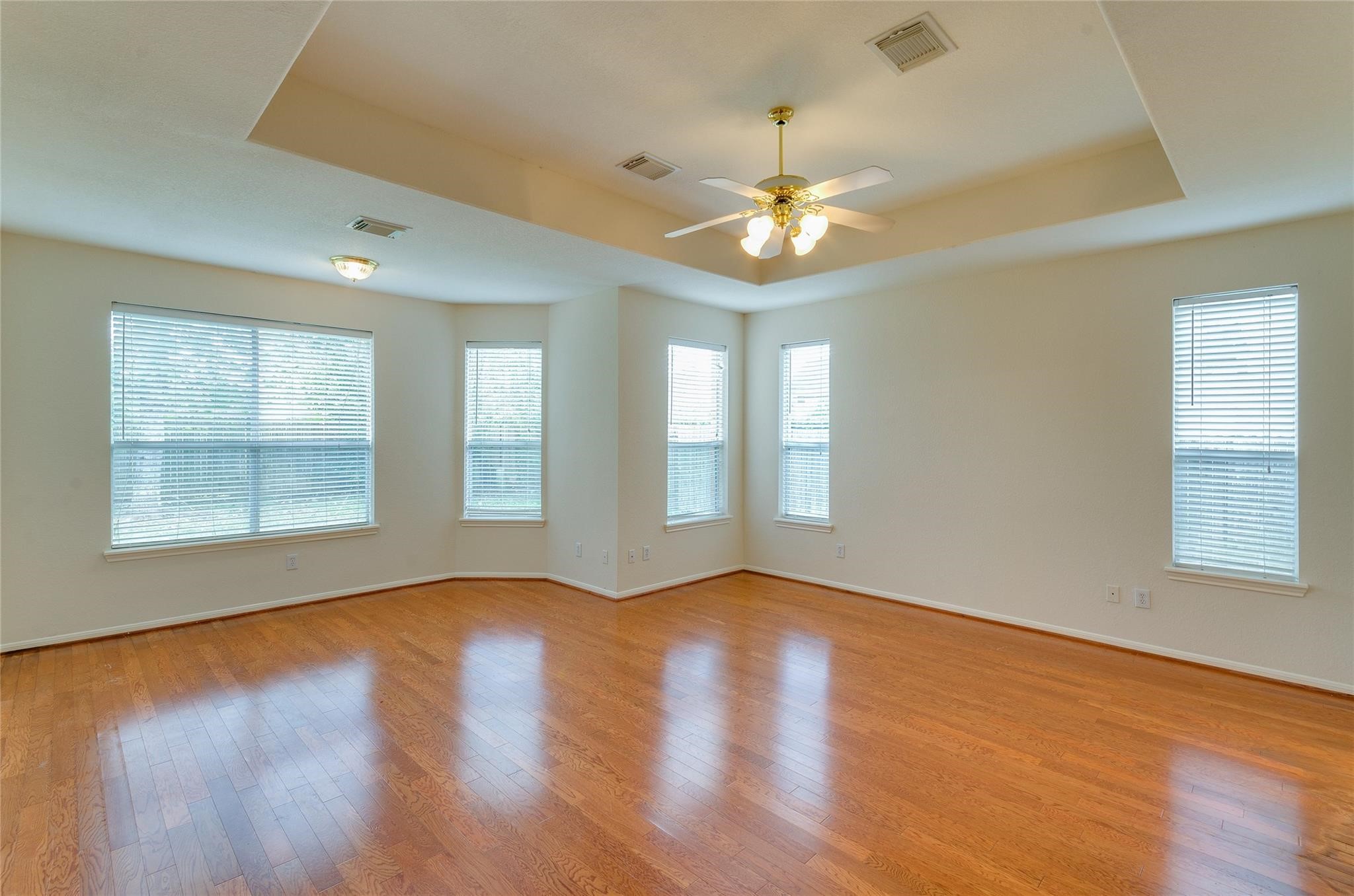 4019 Angel Spring Drive Sugar Land, TX 77479 - Photo 22 of 50 a view of an empty room with wooden floor and a window