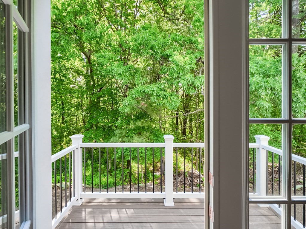 168 River Road East, Unit LOT 2 Hudson, MA 01749 - Photo 8 of 10 a view of a deck and yard from a window