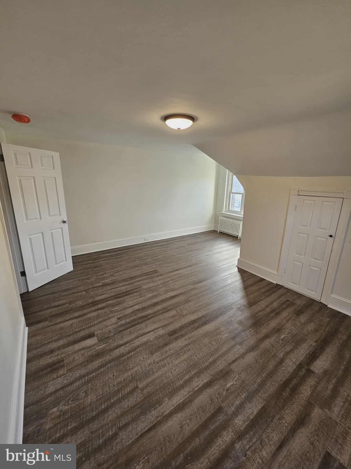 501 West Callowhill Street, Unit 7 Perkasie, PA 18944 - Photo 8 of 8 a view of an empty room with wooden floor and a window