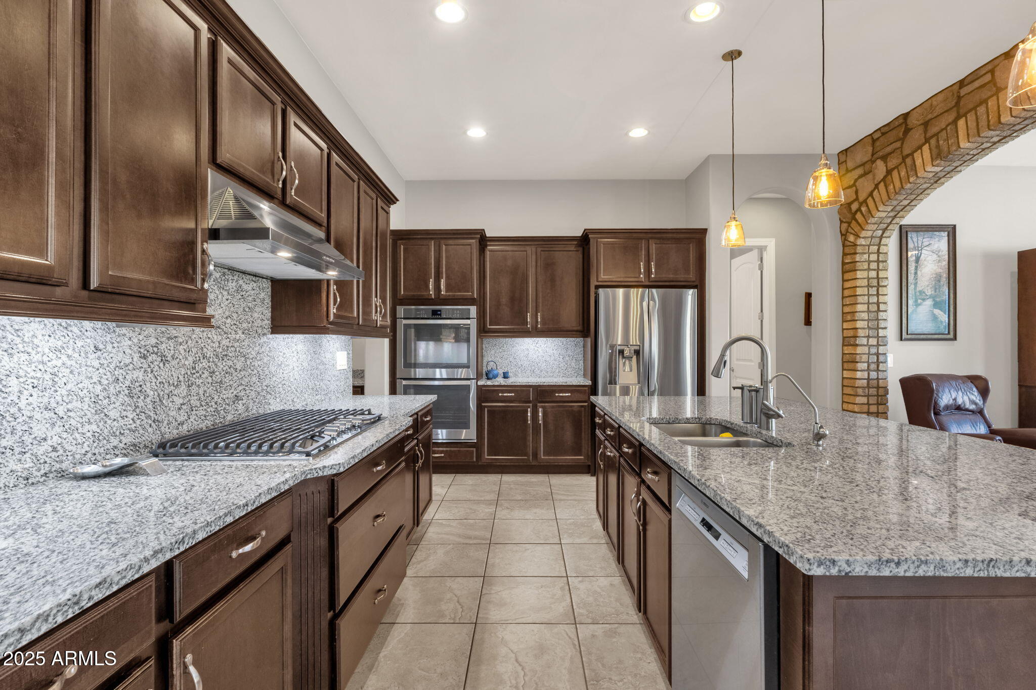 22322 East Rosa Road Queen Creek, AZ 85142 - Photo 10 of 83 a kitchen with stainless steel appliances granite countertop a sink stove and refrigerator