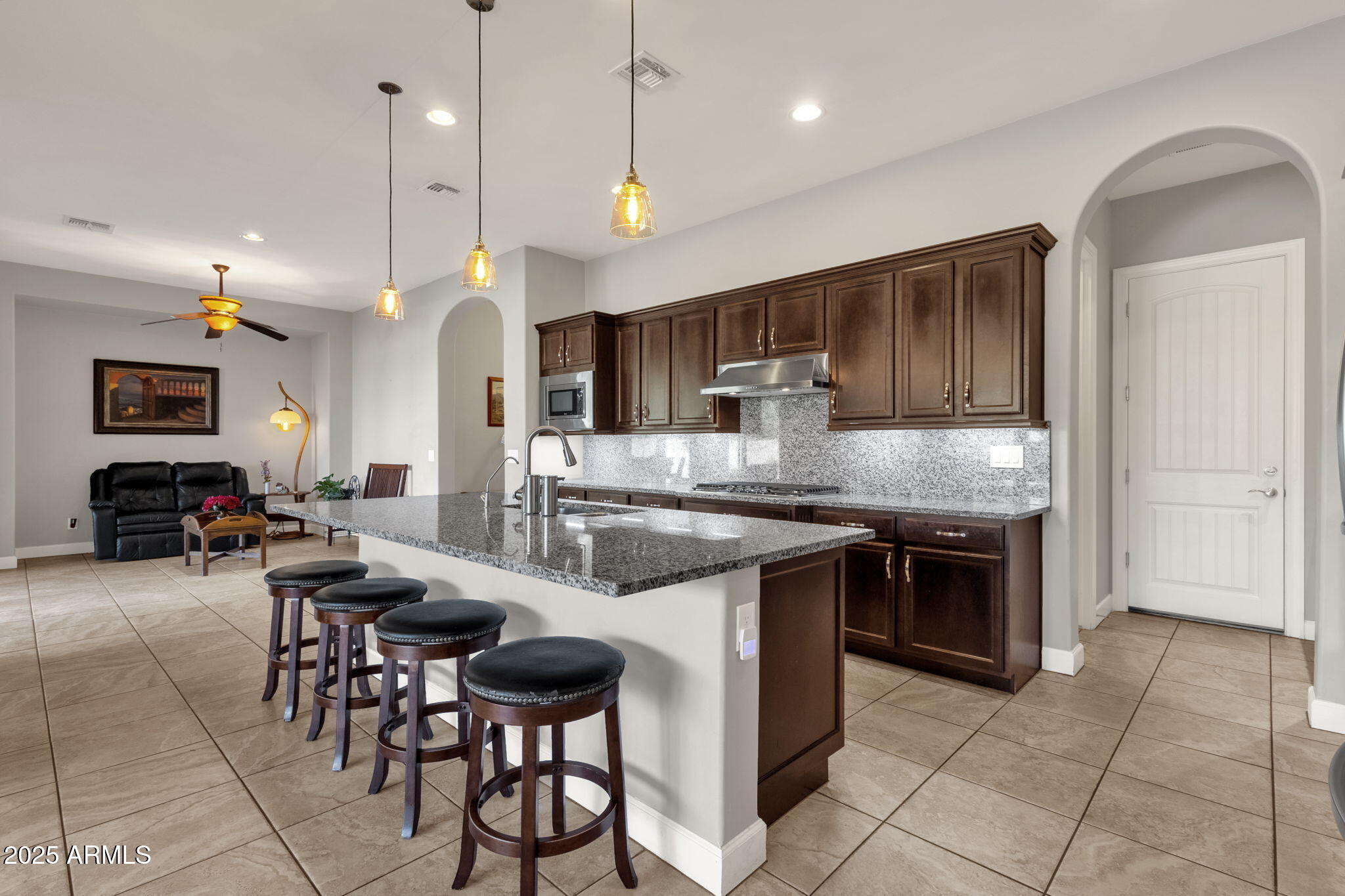 22322 East Rosa Road Queen Creek, AZ 85142 - Photo 13 of 83 a large kitchen with cabinets table and chairs