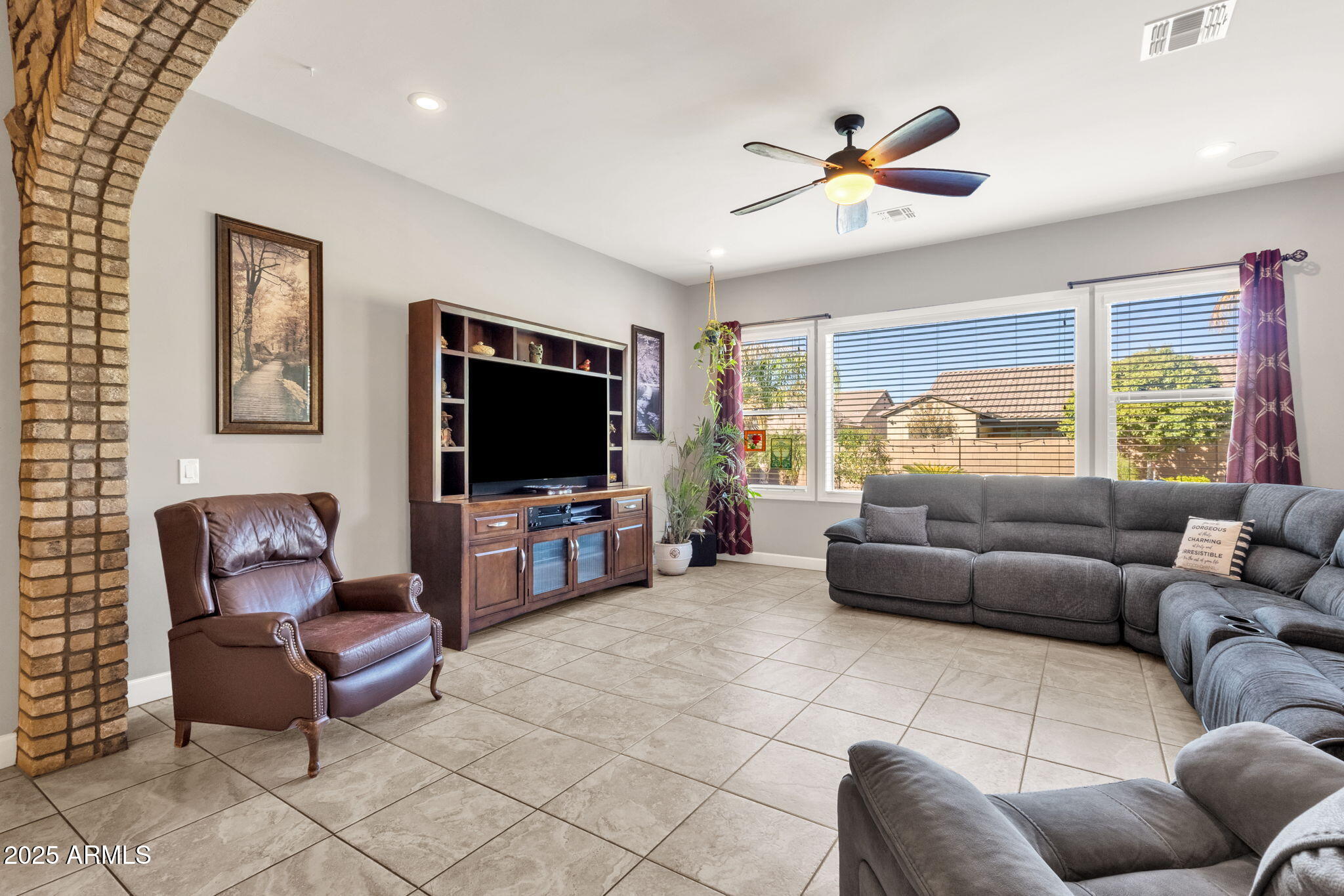22322 East Rosa Road Queen Creek, AZ 85142 - Photo 18 of 83 a living room with furniture and a flat screen tv