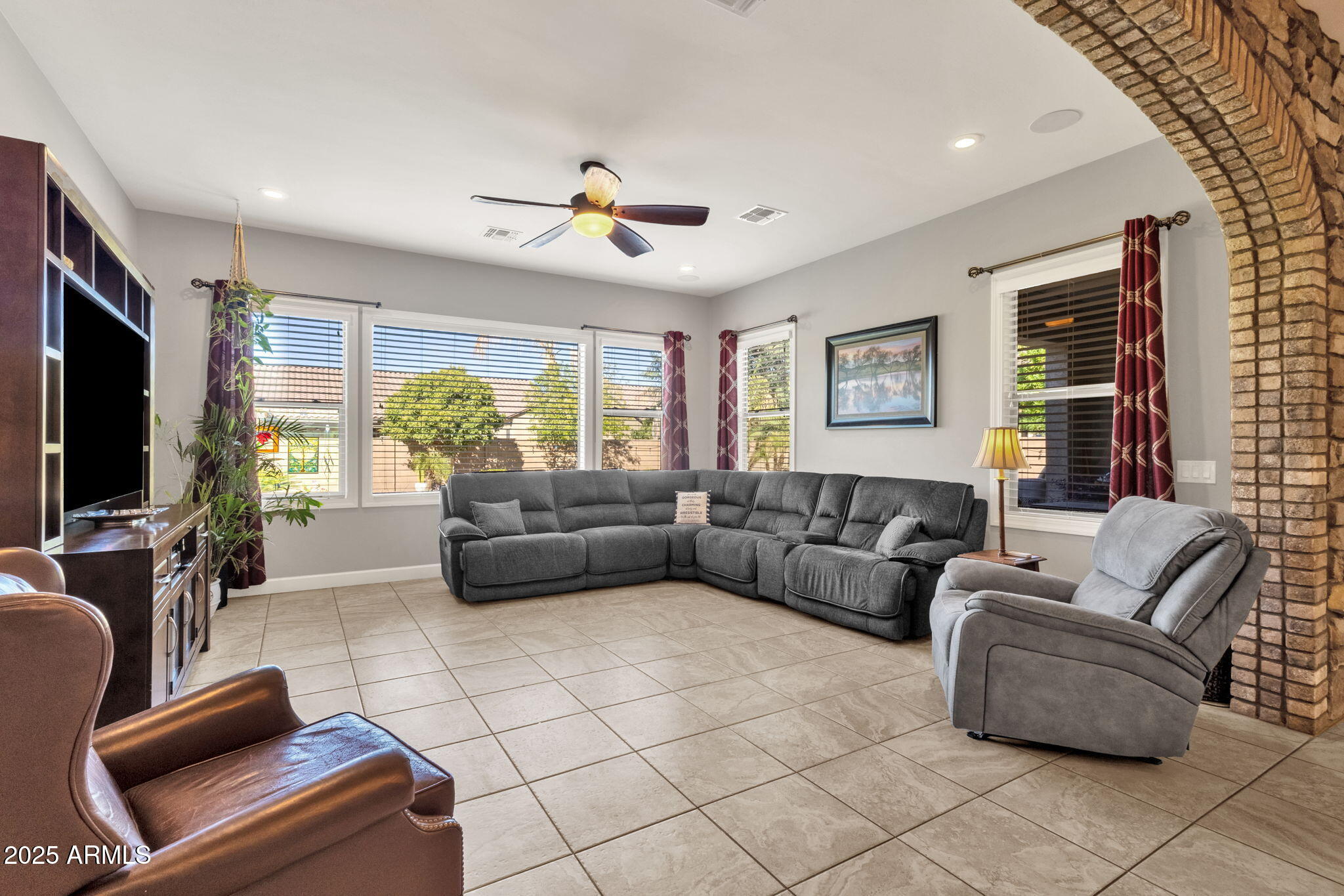 22322 East Rosa Road Queen Creek, AZ 85142 - Photo 19 of 83 a living room with furniture and a flat screen tv