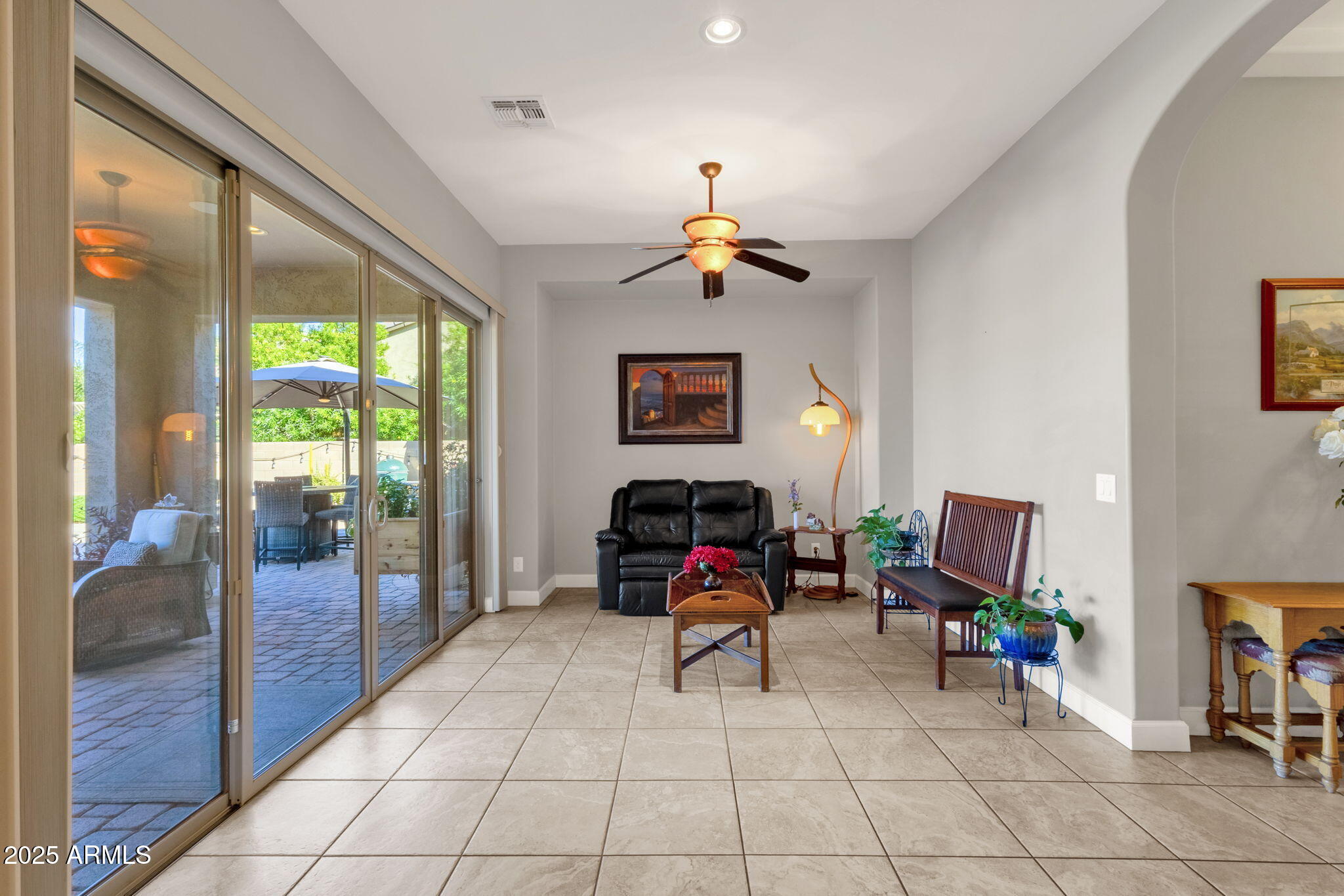 22322 East Rosa Road Queen Creek, AZ 85142 - Photo 22 of 83 a living room with furniture a flat screen tv and a window