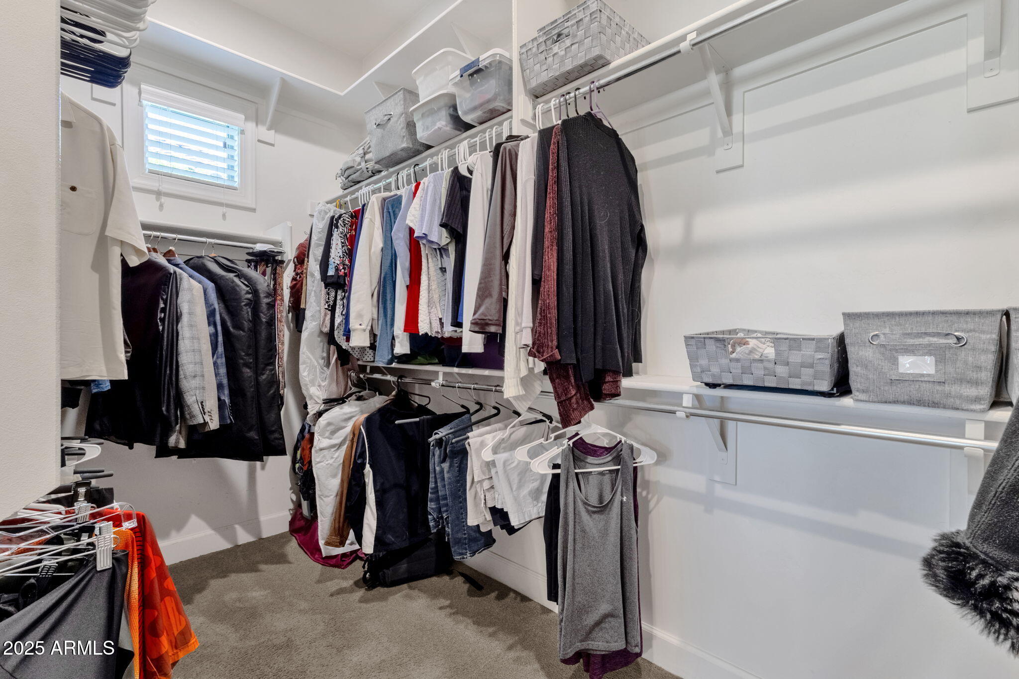 22322 East Rosa Road Queen Creek, AZ 85142 - Photo 34 of 83 a view of walk in closet with clothes and shoes