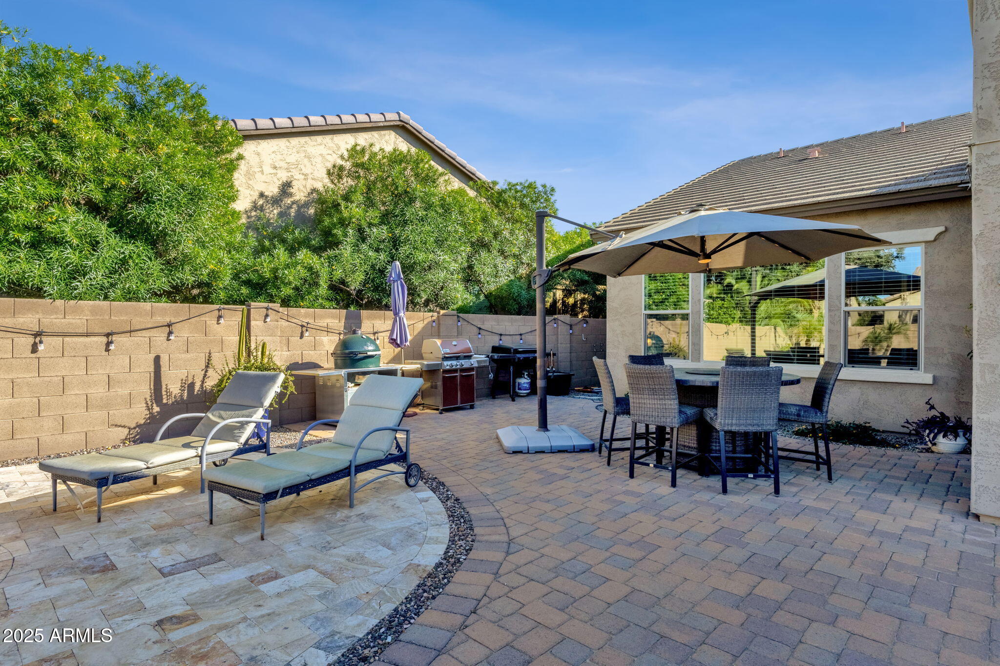 22322 East Rosa Road Queen Creek, AZ 85142 - Photo 51 of 83 a view of a patio with table and chairs and potted plants