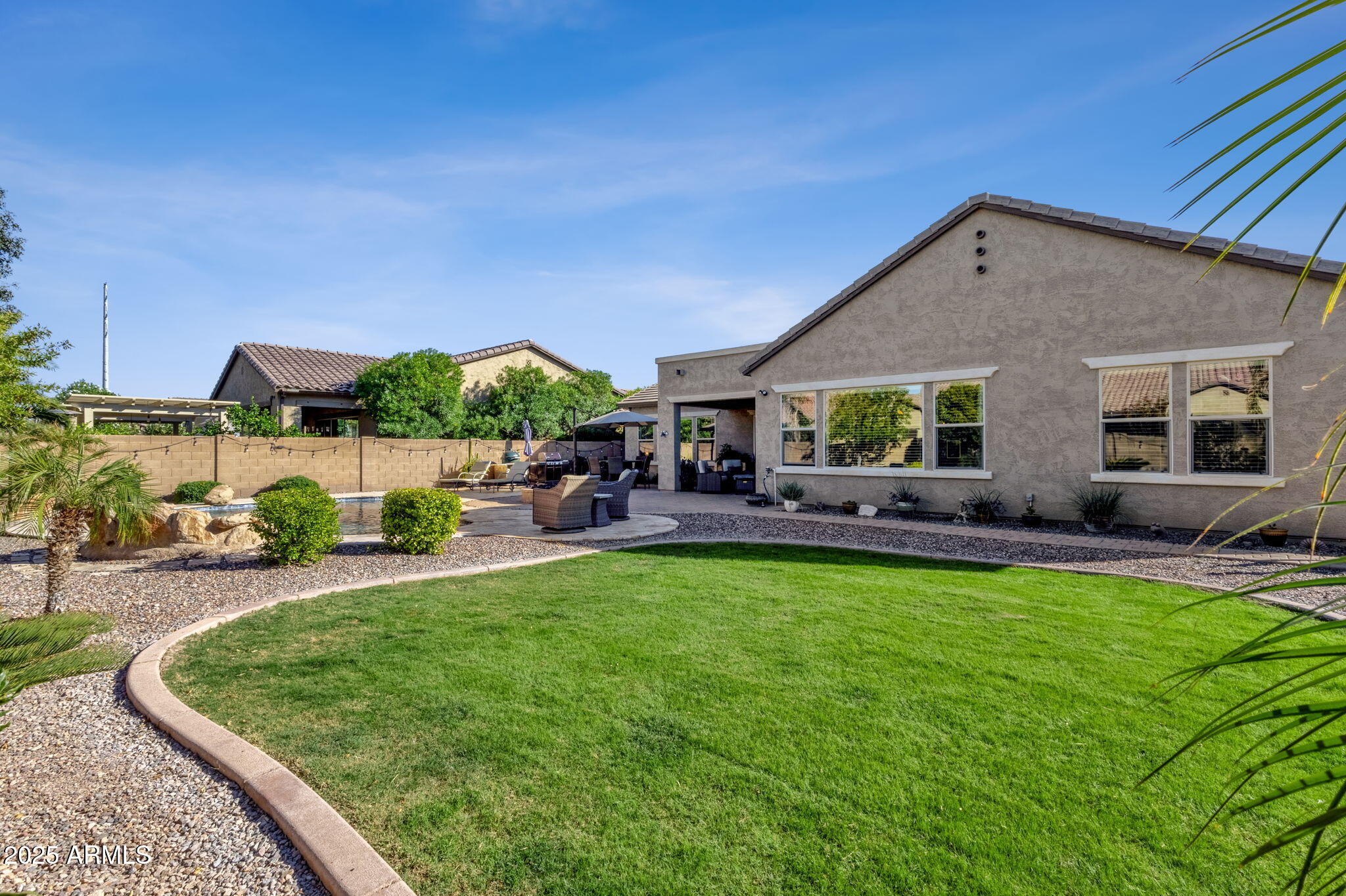 22322 East Rosa Road Queen Creek, AZ 85142 - Photo 55 of 83 a view of a house with backyard porch and sitting area