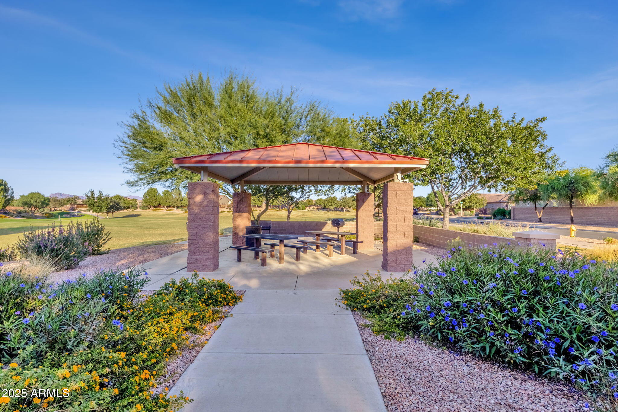 22322 East Rosa Road Queen Creek, AZ 85142 - Photo 71 of 83 a view of a patio with a table and chairs under an umbrella