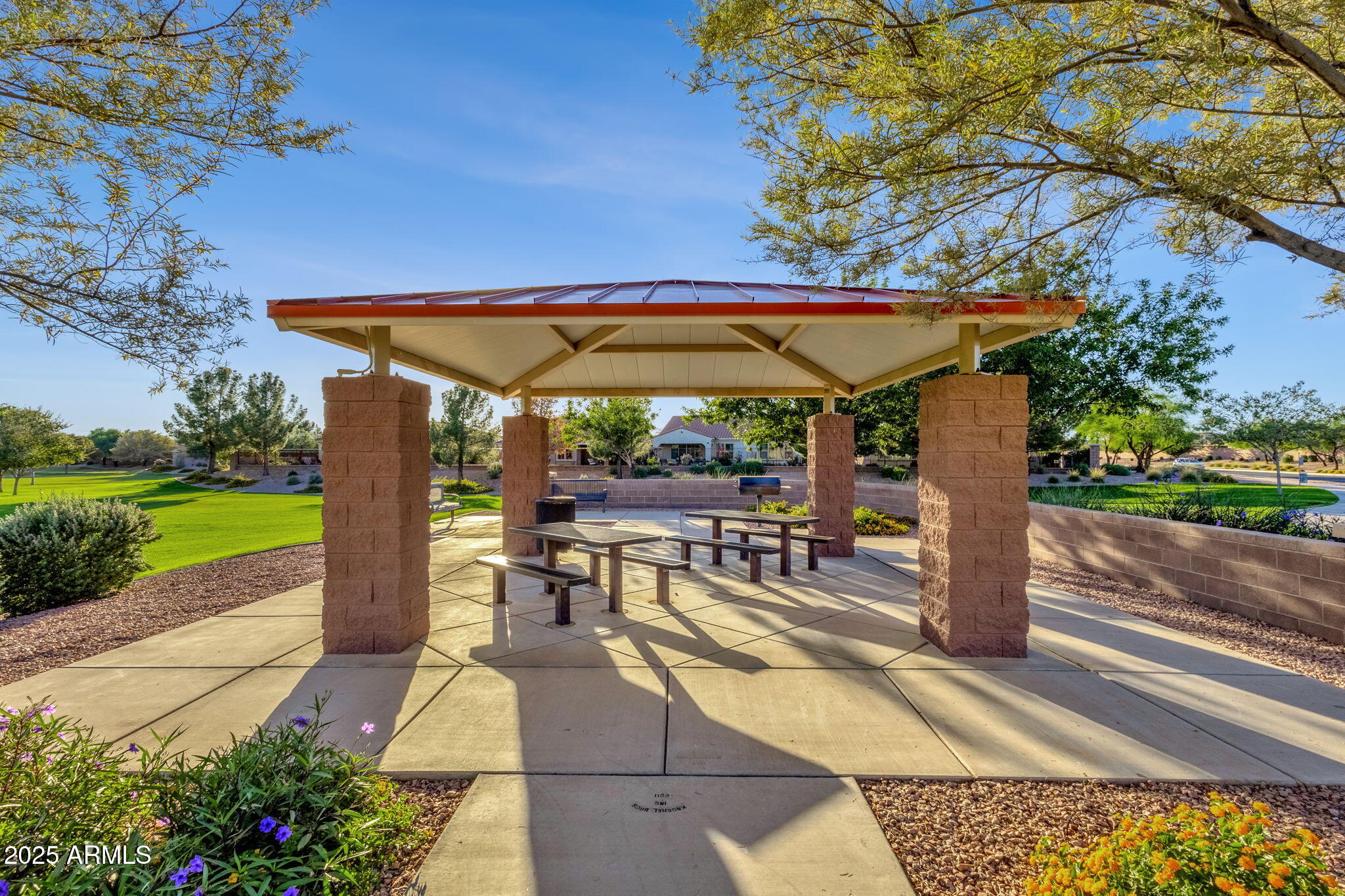 22322 East Rosa Road Queen Creek, AZ 85142 - Photo 72 of 83 a view of a patio with table and chairs under an umbrella with a small yard