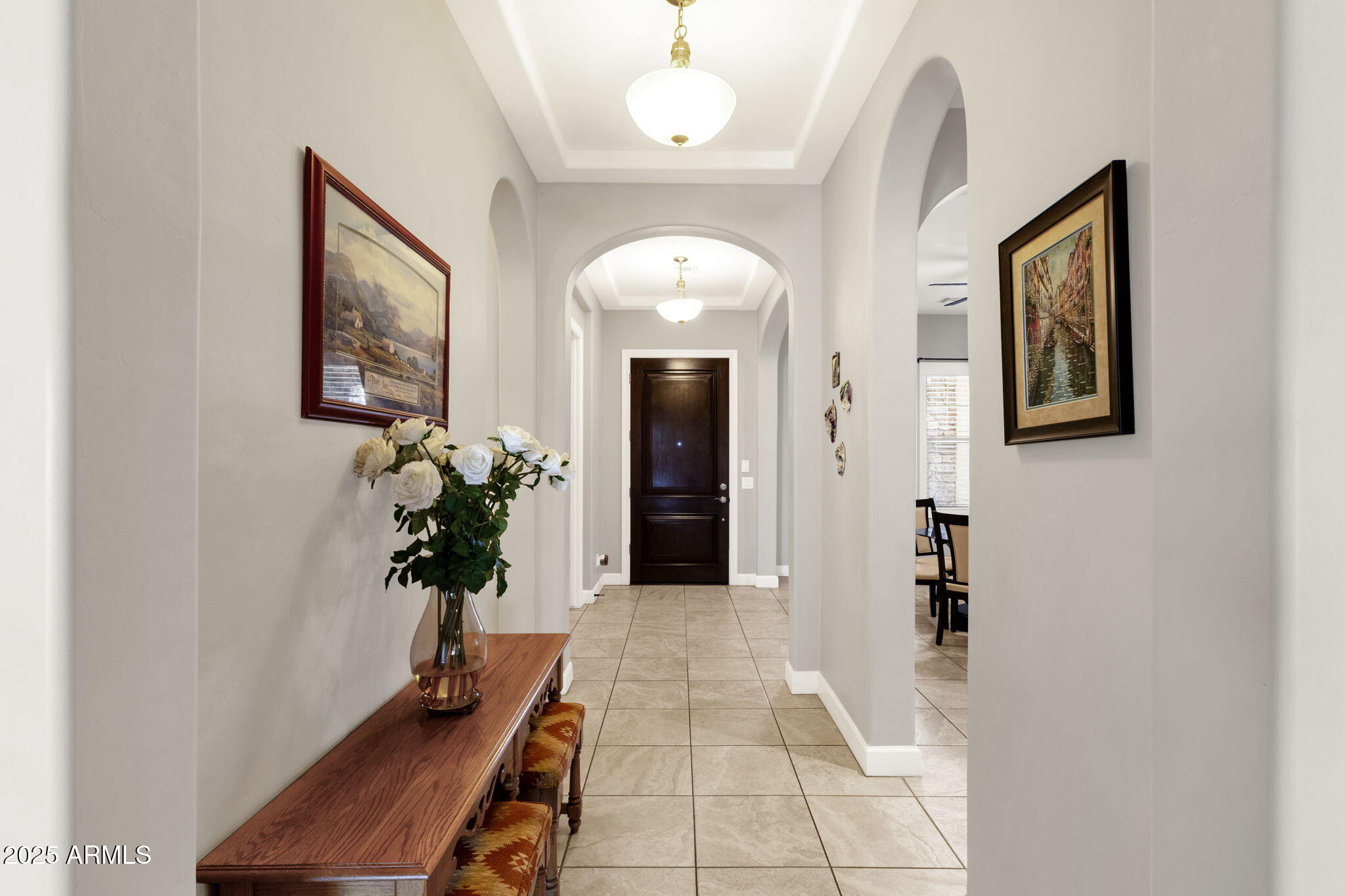 22322 East Rosa Road Queen Creek, AZ 85142 - Photo 7 of 83 a view of a hallway with wooden floor and a potted plant