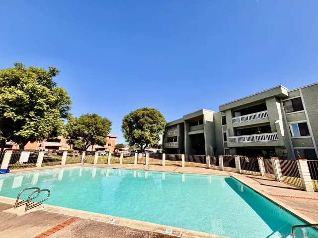 a view of swimming pool with outdoor seating