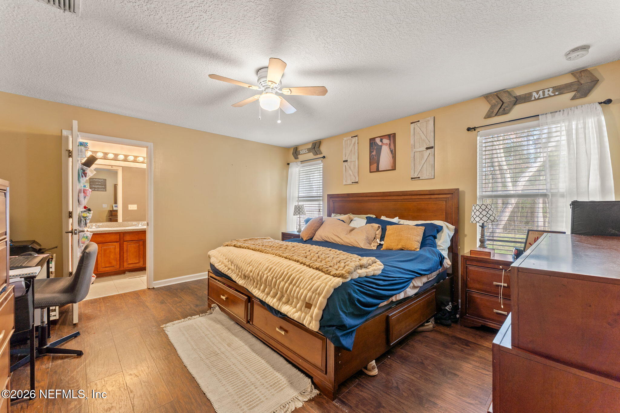 45212 Ingleham Circle Callahan, FL 32011 - Photo 15 of 35 a bed room with a bed and a chair