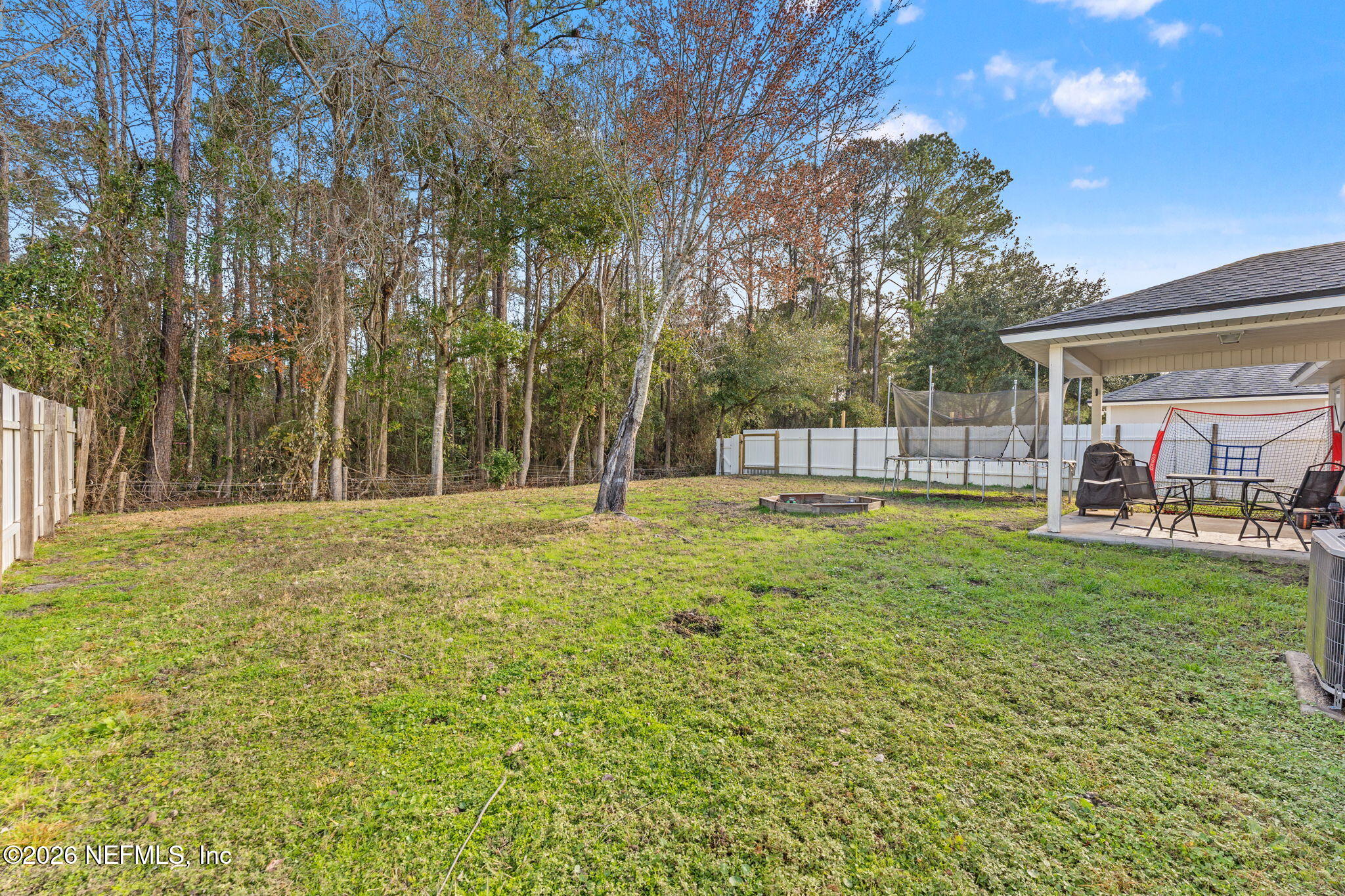 45212 Ingleham Circle Callahan, FL 32011 - Photo 19 of 35 a view of a house with backyard and sitting area