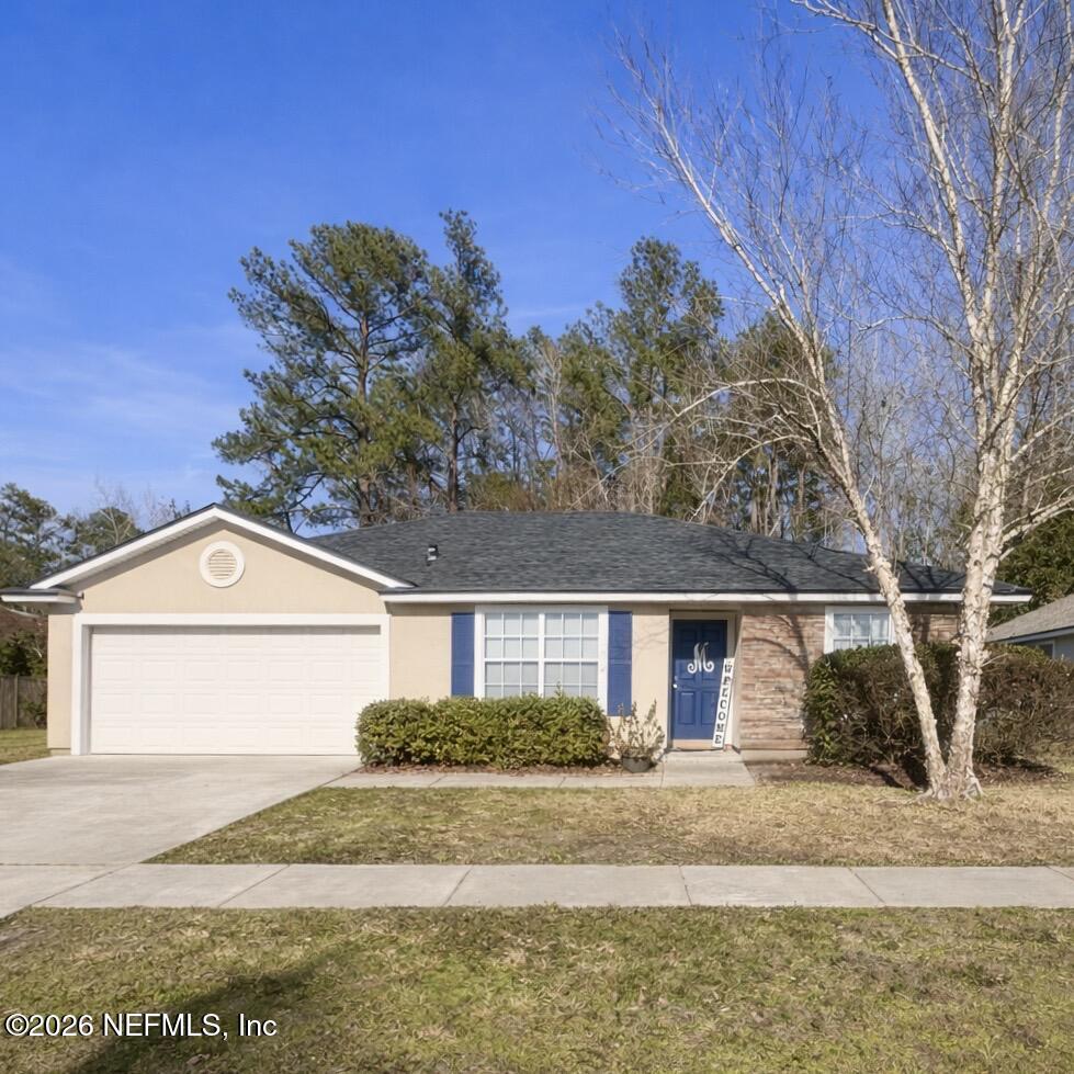 45212 Ingleham Circle Callahan, FL 32011 - Photo 2 of 35 a front view of a house with a yard