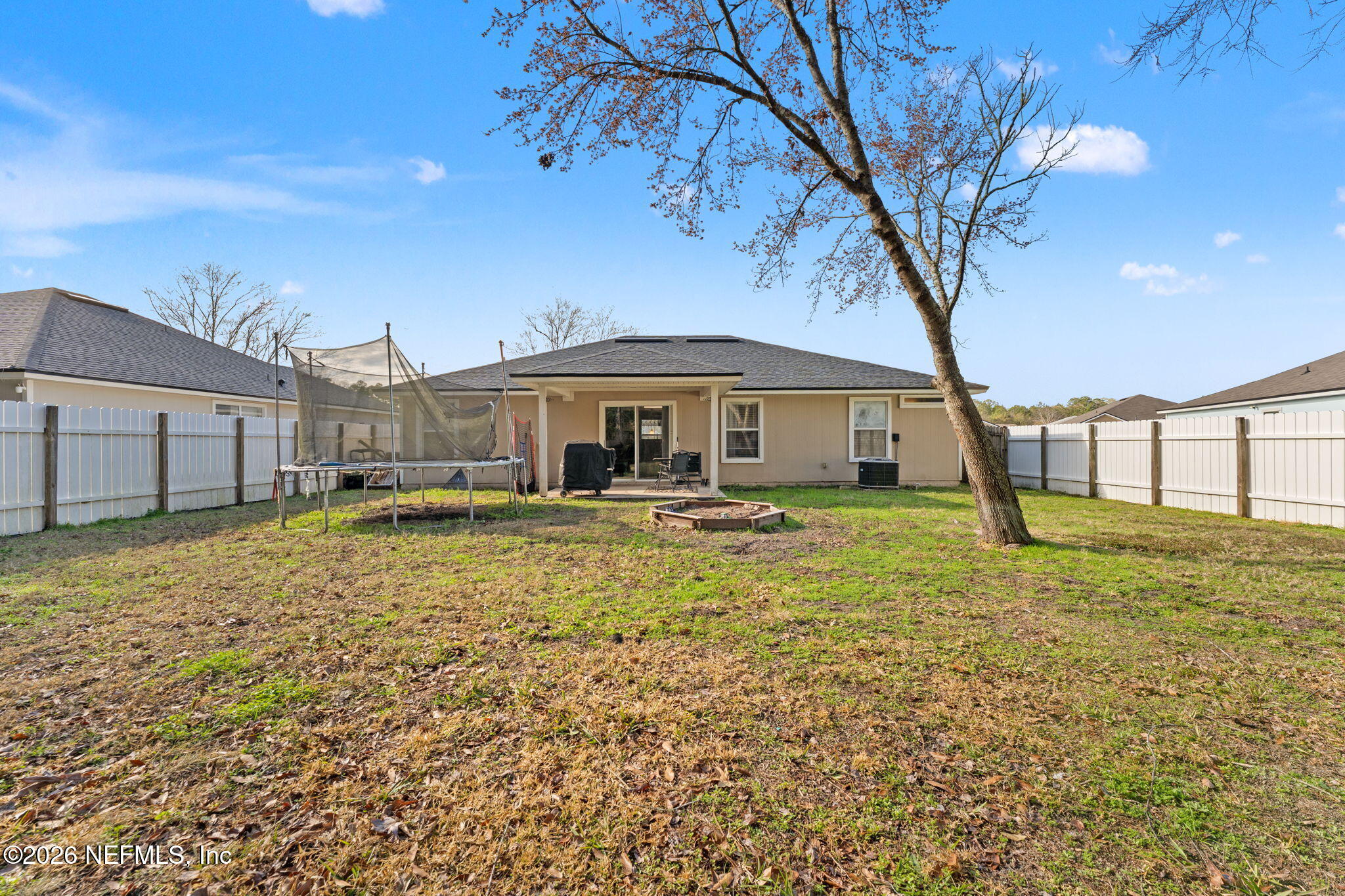 45212 Ingleham Circle Callahan, FL 32011 - Photo 21 of 35 a front view of a house with garden