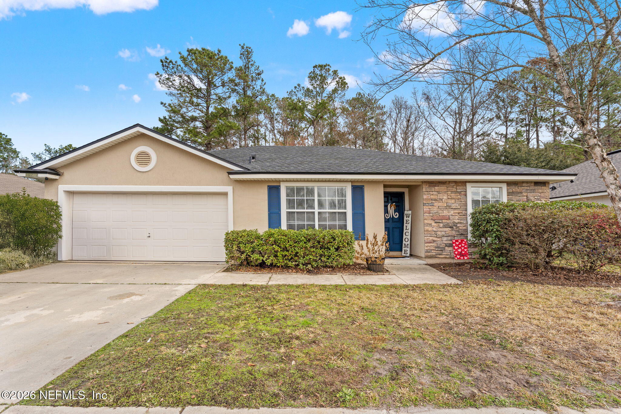 45212 Ingleham Circle Callahan, FL 32011 - Photo 29 of 35 front view of a house with a yard