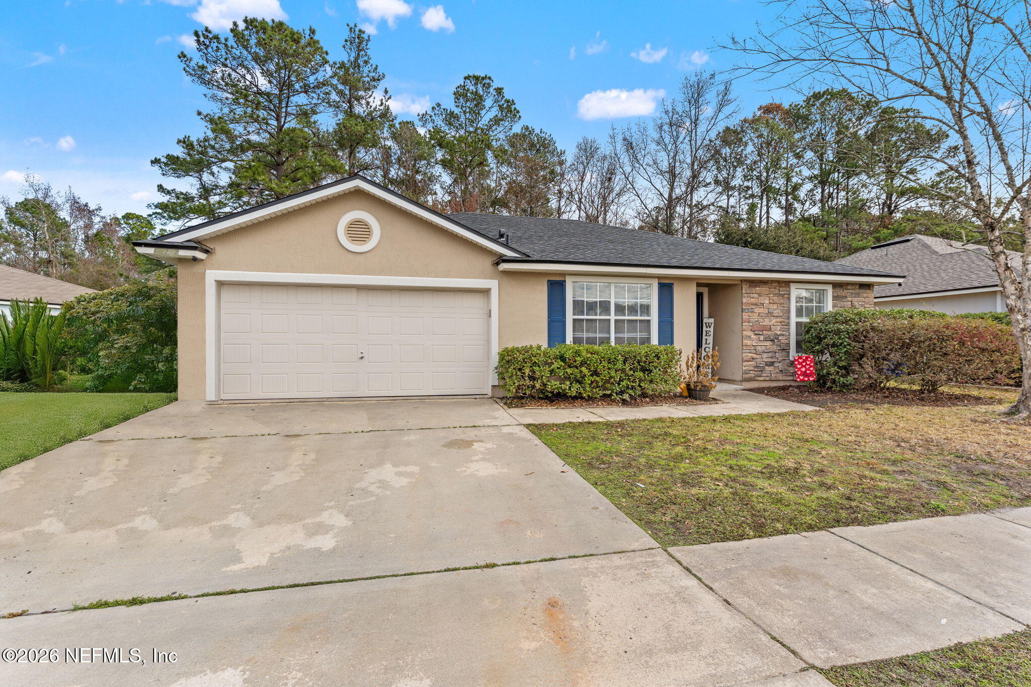 45212 Ingleham Circle Callahan, FL 32011 - Photo 3 of 35 a front view of a house with garden
