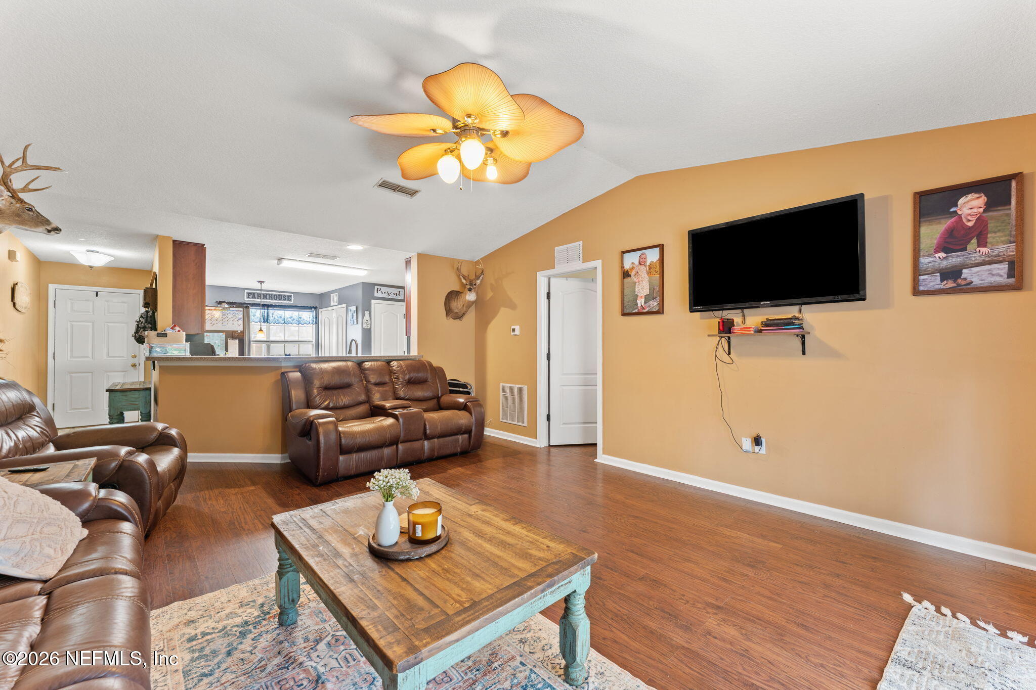 45212 Ingleham Circle Callahan, FL 32011 - Photo 6 of 35 a living room with furniture and a flat screen tv