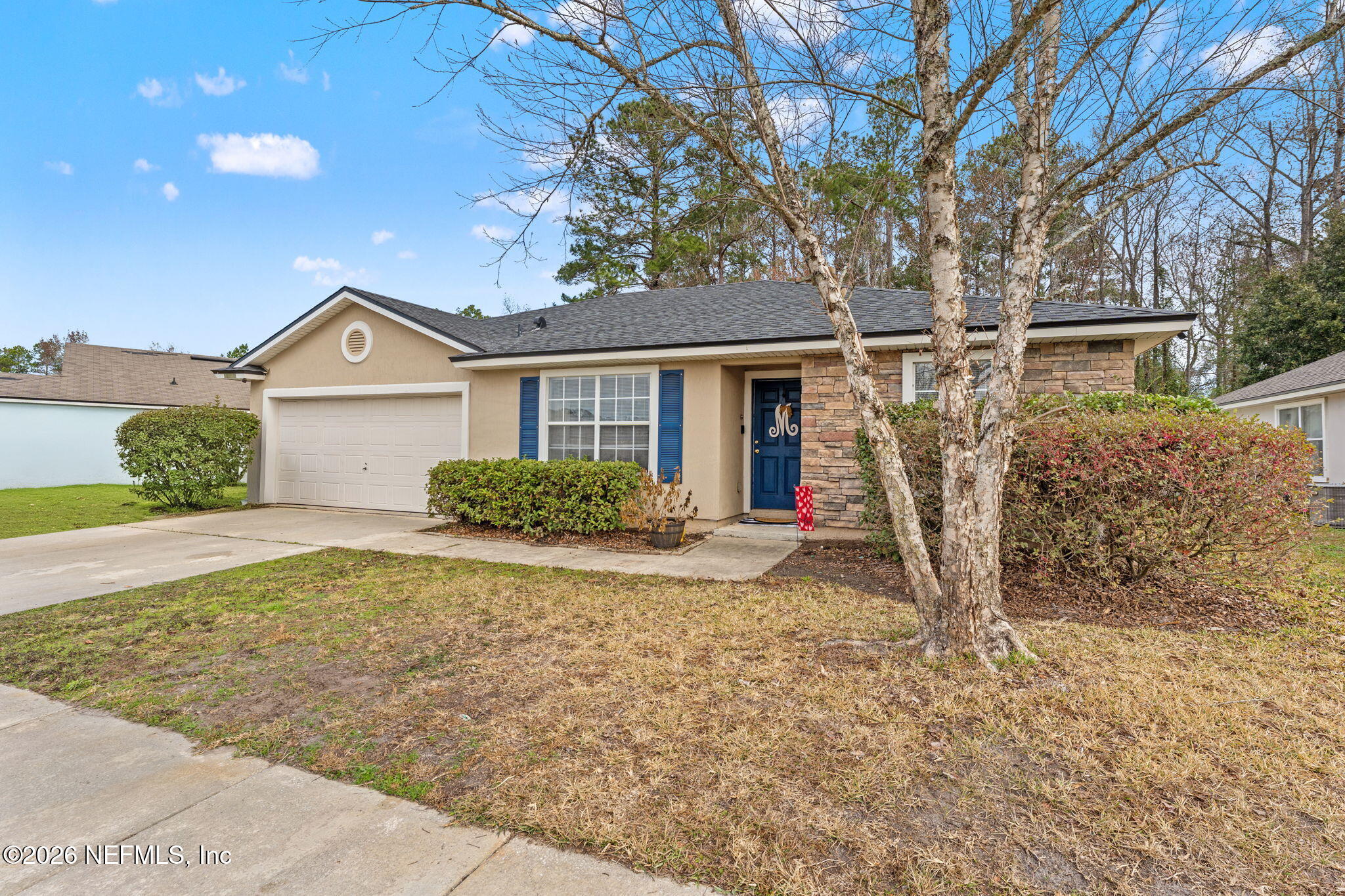 45212 Ingleham Circle Callahan, FL 32011 - Photo 10 of 35 front view of a house with a porch