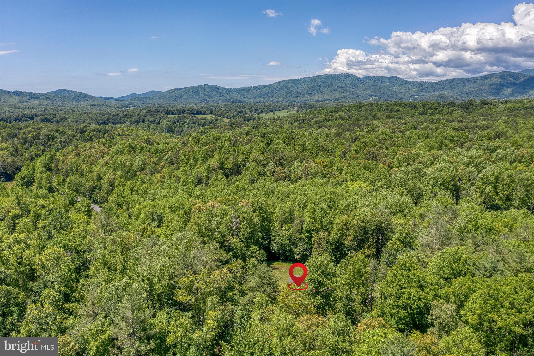 803 Weaver Hollow Road Banco, VA 22711 - Photo 54 of 67 a view of a lush green hillside and a houses