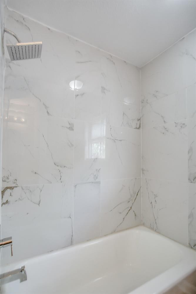 4509 40th Street Lubbock, TX 79414 - Photo 16 of 21 a bathroom with a bathtub