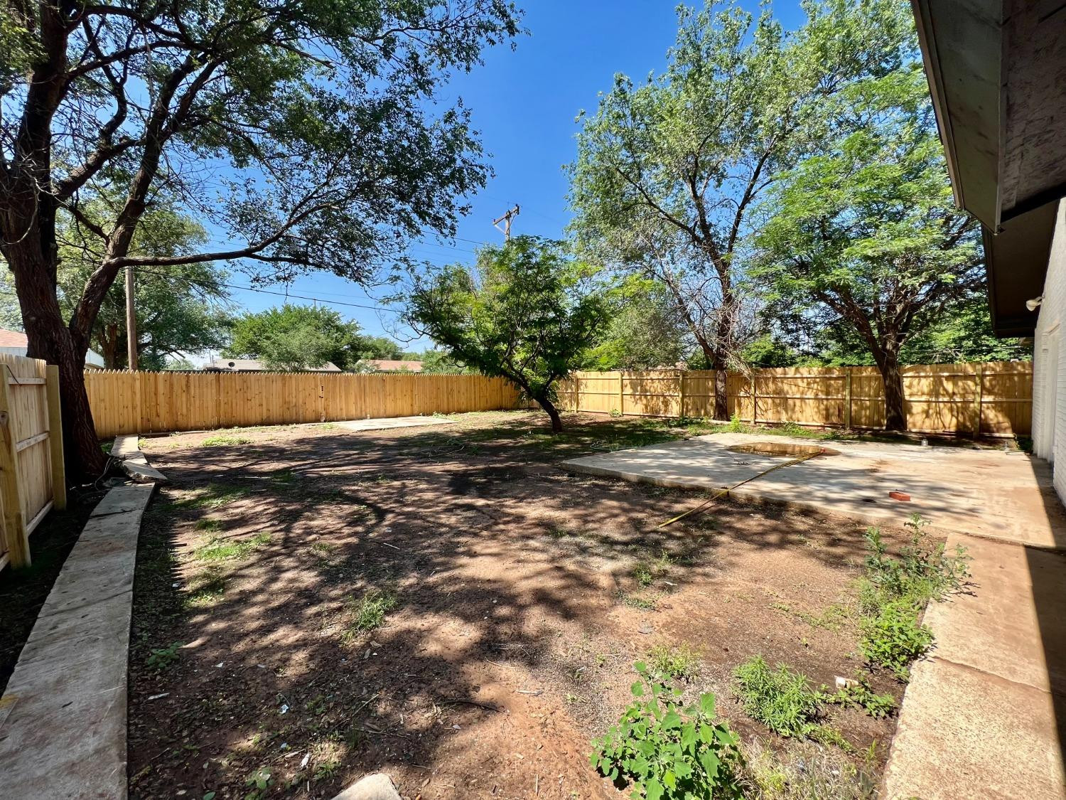 4509 40th Street Lubbock, TX 79414 - Photo 20 of 21 a view of yard with tree