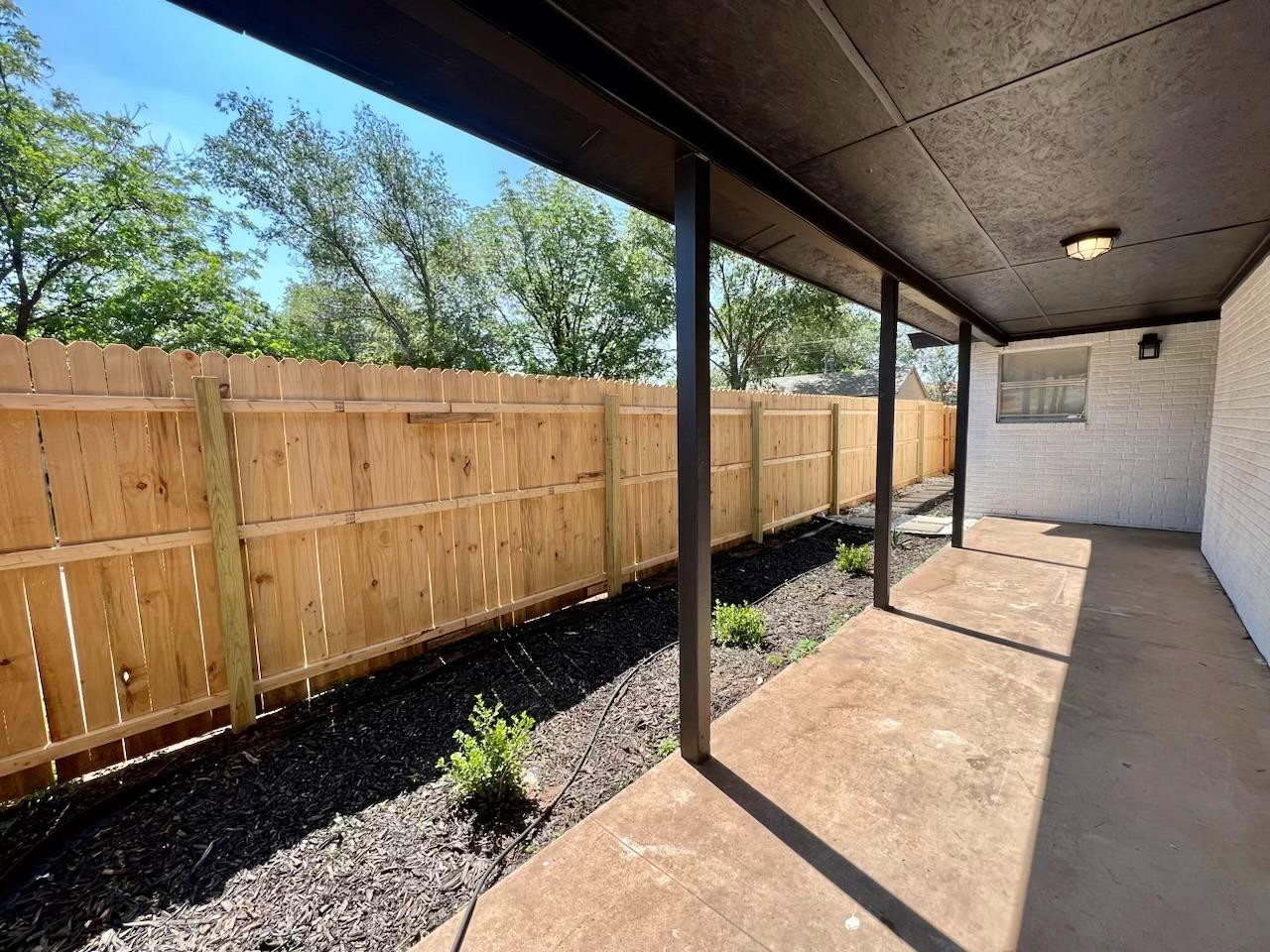 4509 40th Street Lubbock, TX 79414 - Photo 2 of 21 a view of a back yard of the house