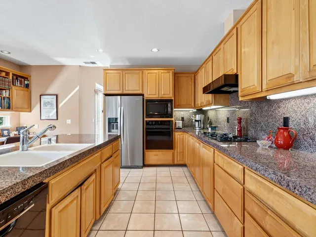 a very nice looking kitchen with a large window
