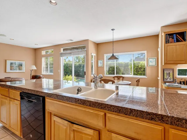 a reading room with furniture and book shelf
