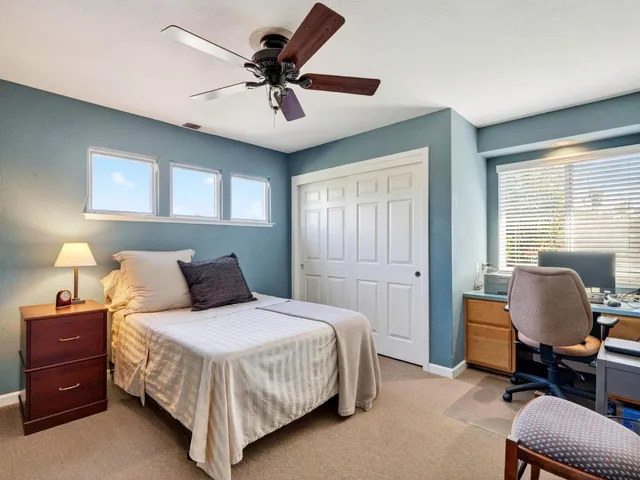 a view of backyard with outdoor seating and plants