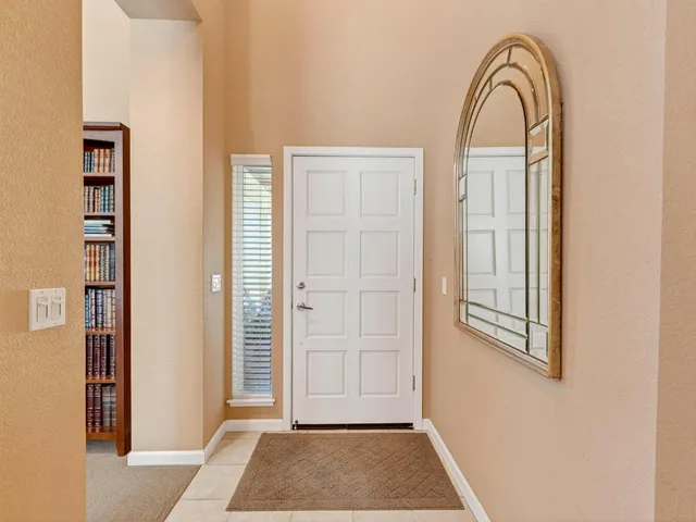a living room with furniture rug and window