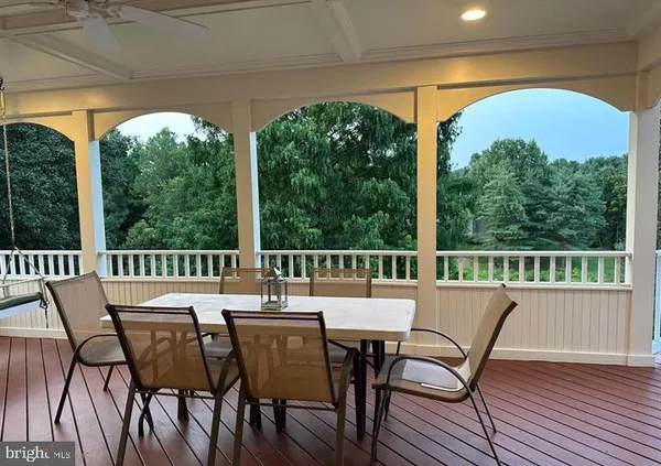 a view of a city from a dining room with furniture and window