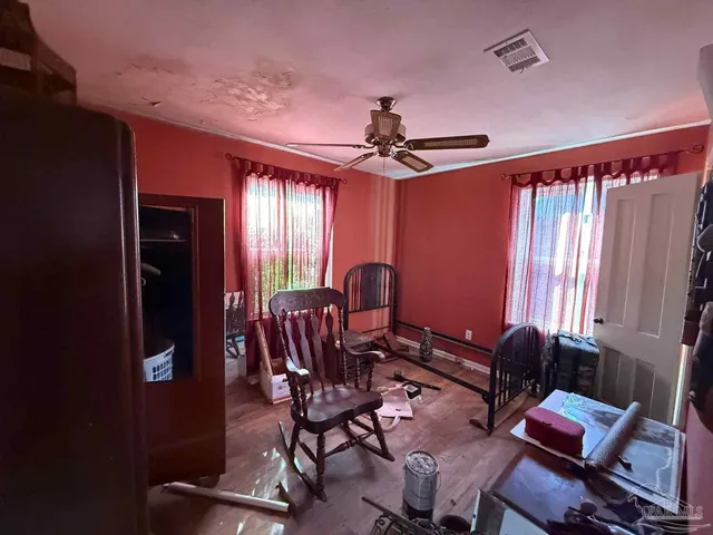 a work room with furniture and musical instruments