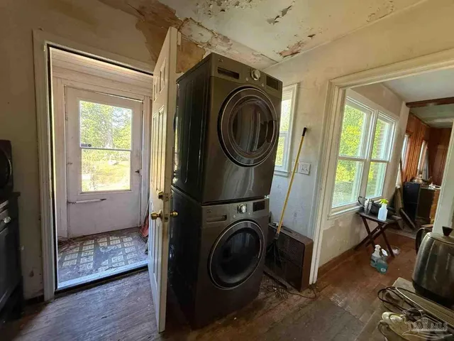 a view of a storage and utility room with washer and dryer